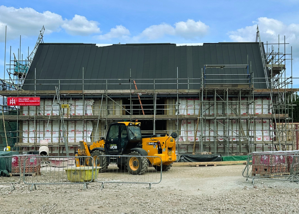 Picture of Newhall Community Centre, now with its zinc roof.